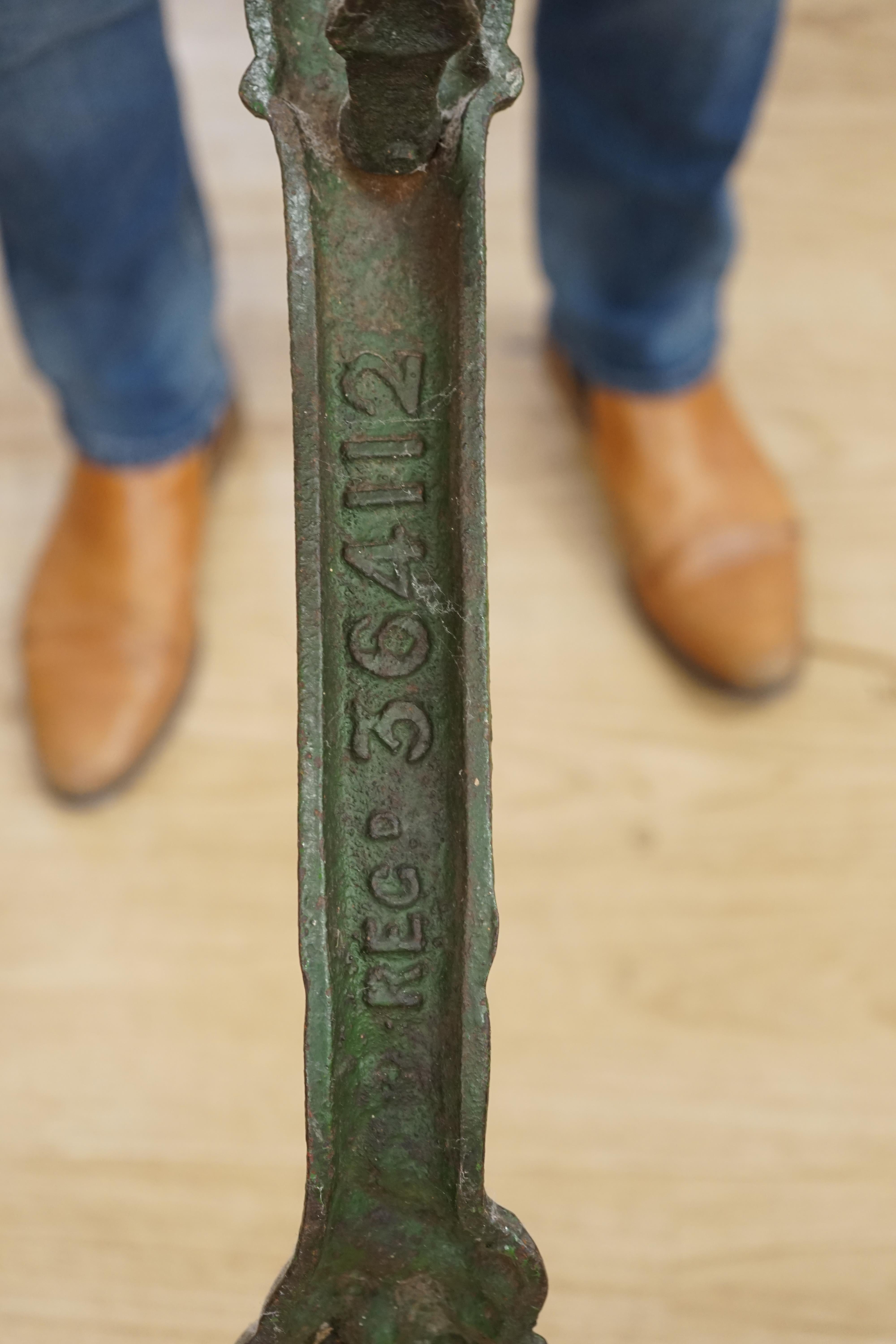 A rare early 20th century Boer War commemorative cast iron pub table, decorated with standing soldiers beneath Ladysmith, Pretoria and Mafeking scrolls, legs bearing registered number 364112, the circular oak top 62cm di